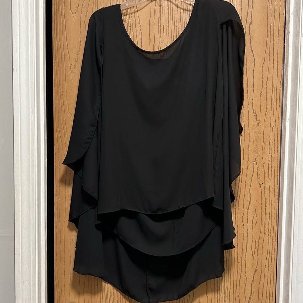 Torrid short with attached cape detail in the back. Size 1 black.
